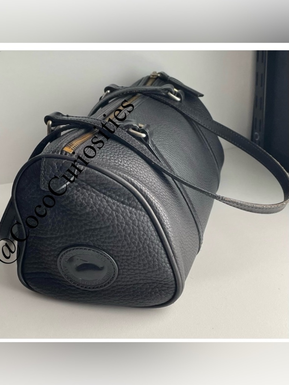 Dooney and Bourke awl  pebbled leather barrel bag
